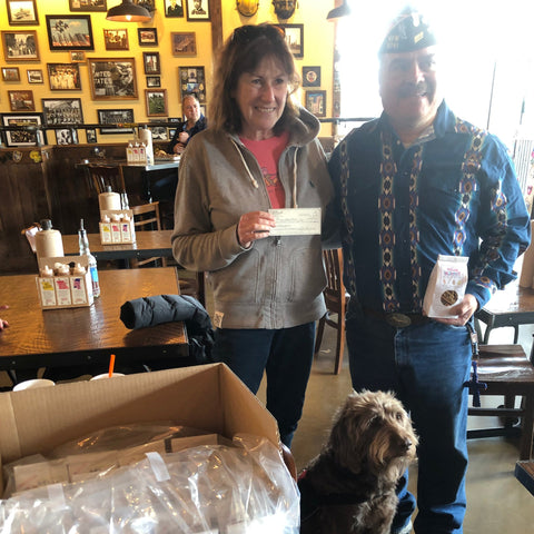 Operation Fetch Receives Check And Donation Of Snacks From Snarf Foods